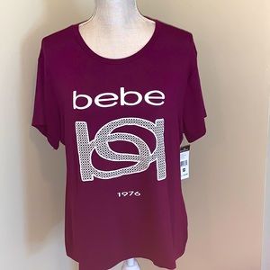 bebe, size 2X, women’s casual t-shirt in jersey material, vibrant plum color.